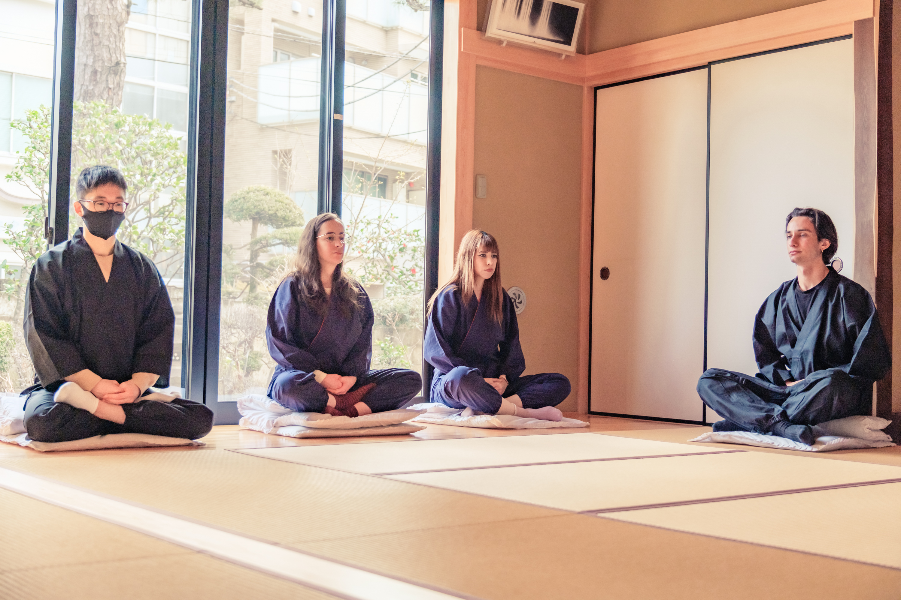 Participants sitting in a temple zazen session